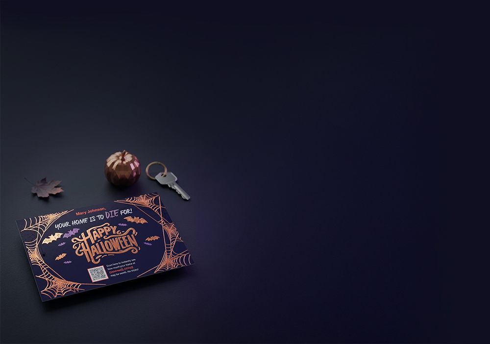 Halloween foil postcard on a dark table with a pumpkin, maple leaf, and house key